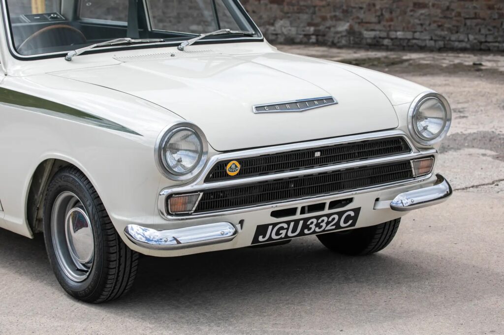 A 1965 Ford Lotus Cortina Mk1 with just 2,561 miles sold for £41,000 at auction, a rare classic restored to outstanding condition and verified by experts.