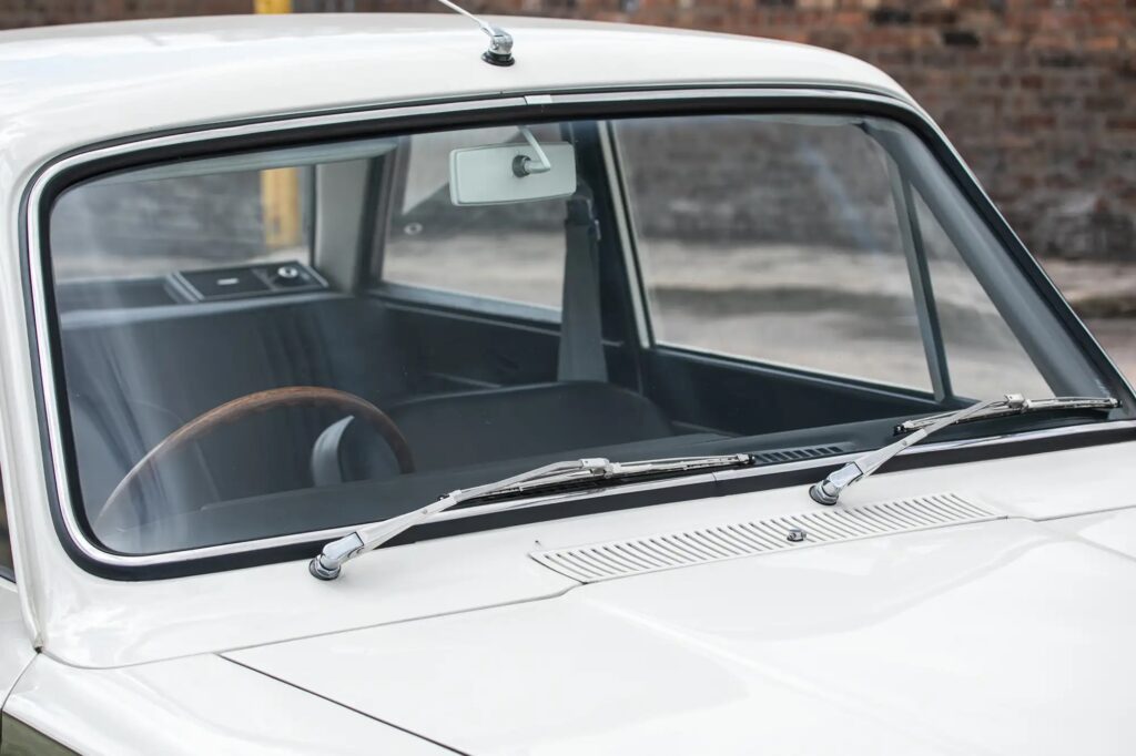A 1965 Ford Lotus Cortina Mk1 with just 2,561 miles sold for £41,000 at auction, a rare classic restored to outstanding condition and verified by experts.