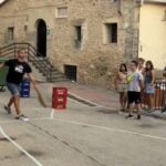 A tiny Spanish village, Carrascosa de la Sierra, hosts the annual Ham Throwing Championship where locals hurl wrapped hams, with this year’s winning throw reaching 20.55m.