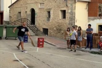 A tiny Spanish village, Carrascosa de la Sierra, hosts the annual Ham Throwing Championship where locals hurl wrapped hams, with this year’s winning throw reaching 20.55m.