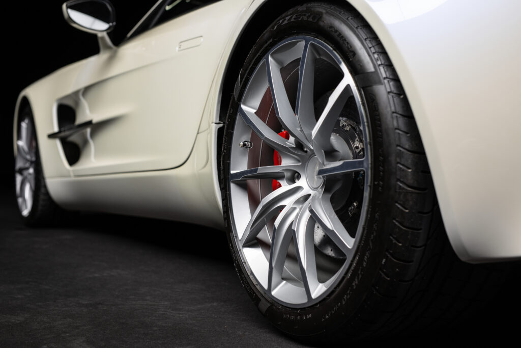 Aston Martin One-77 hypercar heads to auction in Abu Dhabi for £1.18m. One of only 77 made, it boasts a 7.3L V12, 750bhp, 217mph top speed and stunning design.