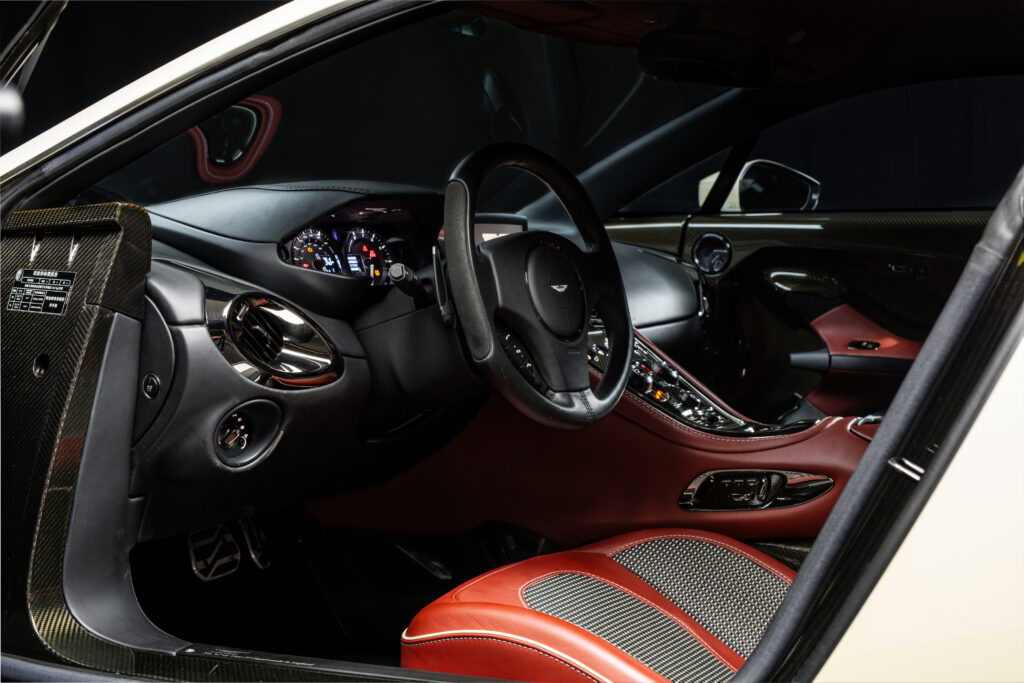 Aston Martin One-77 hypercar heads to auction in Abu Dhabi for £1.18m. One of only 77 made, it boasts a 7.3L V12, 750bhp, 217mph top speed and stunning design.