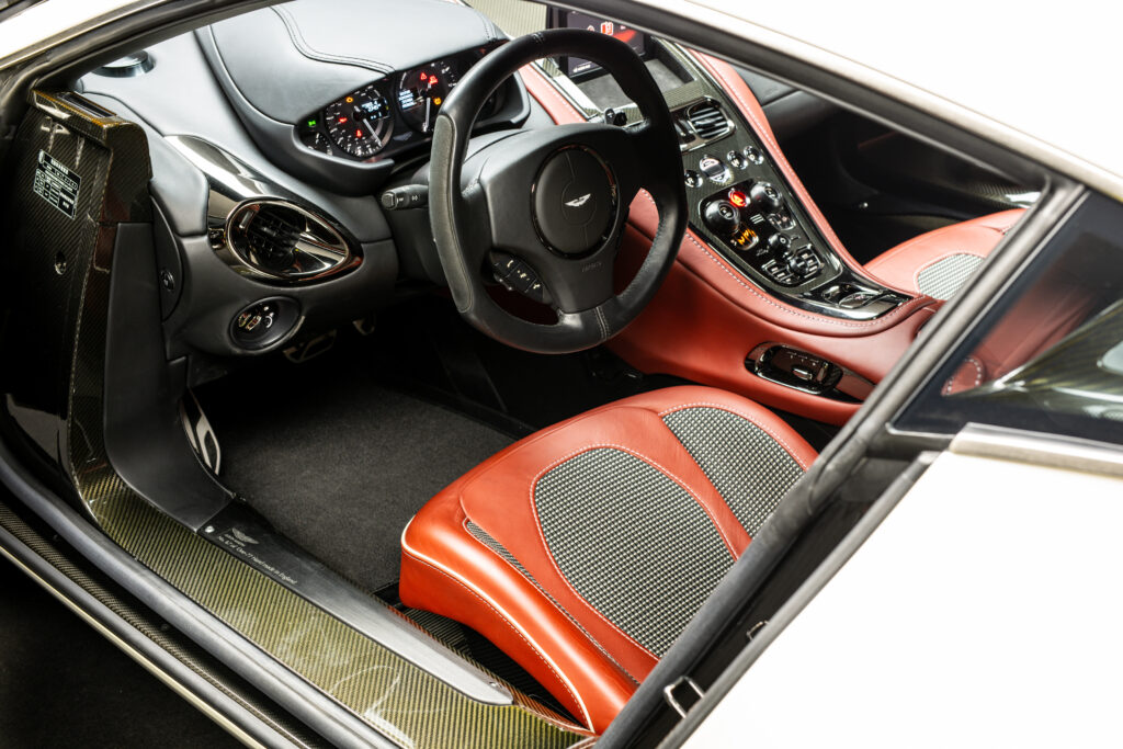 Aston Martin One-77 hypercar heads to auction in Abu Dhabi for £1.18m. One of only 77 made, it boasts a 7.3L V12, 750bhp, 217mph top speed and stunning design.
