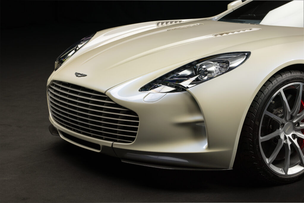 Aston Martin One-77 hypercar heads to auction in Abu Dhabi for £1.18m. One of only 77 made, it boasts a 7.3L V12, 750bhp, 217mph top speed and stunning design.
