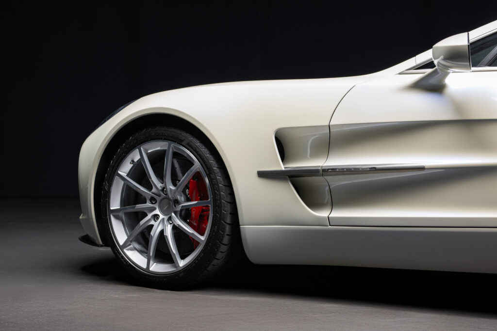 Aston Martin One-77 hypercar heads to auction in Abu Dhabi for £1.18m. One of only 77 made, it boasts a 7.3L V12, 750bhp, 217mph top speed and stunning design.