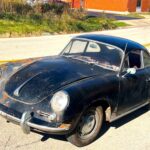 Barn-find 1965 Porsche 356C Coupe listed at £29,000 in New York. Rusted and undriveable but complete with matching numbers, making it a dream restoration project.