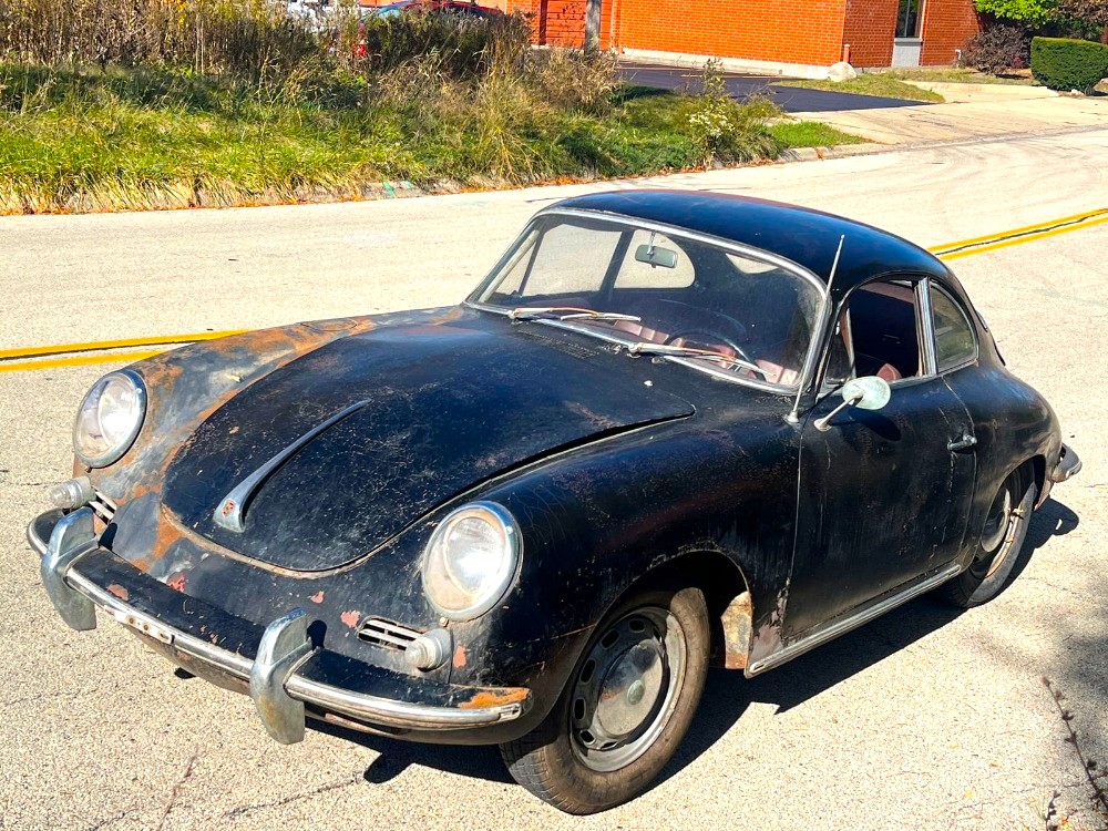 Barn-find 1965 Porsche 356C Coupe listed at £29,000 in New York. Rusted and undriveable but complete with matching numbers, making it a dream restoration project.