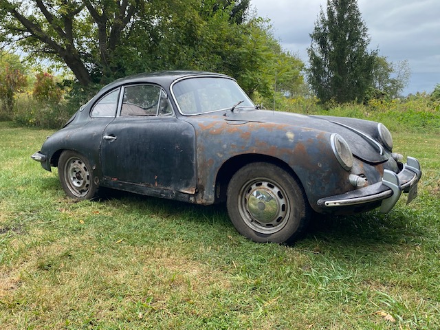 Barn-find 1965 Porsche 356C Coupe listed at £29,000 in New York. Rusted and undriveable but complete with matching numbers, making it a dream restoration project.