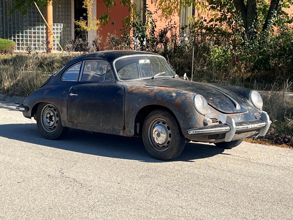 Barn-find 1965 Porsche 356C Coupe listed at £29,000 in New York. Rusted and undriveable but complete with matching numbers, making it a dream restoration project.
