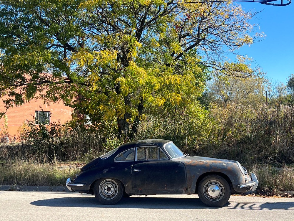 Barn-find 1965 Porsche 356C Coupe listed at £29,000 in New York. Rusted and undriveable but complete with matching numbers, making it a dream restoration project.