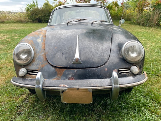 Barn-find 1965 Porsche 356C Coupe listed at £29,000 in New York. Rusted and undriveable but complete with matching numbers, making it a dream restoration project.