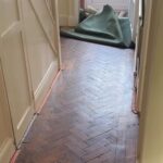 A Leicester couple uncovered stunning herringbone flooring hidden beneath their old carpet, sparking viral fame with 2.5 million views and praise for their lucky home find.