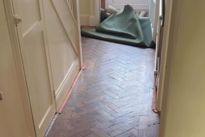 A Leicester couple uncovered stunning herringbone flooring hidden beneath their old carpet, sparking viral fame with 2.5 million views and praise for their lucky home find.
