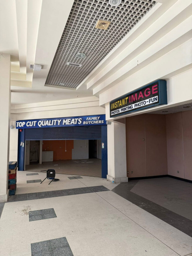 An urban explorer has revealed the eerie inside of a crumbling abandoned shopping mall in Bangor, Northern Ireland, left to rot with moss-covered floors, shattered windows and a collapsing roof.