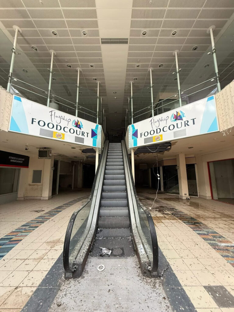 An urban explorer has revealed the eerie inside of a crumbling abandoned shopping mall in Bangor, Northern Ireland, left to rot with moss-covered floors, shattered windows and a collapsing roof.