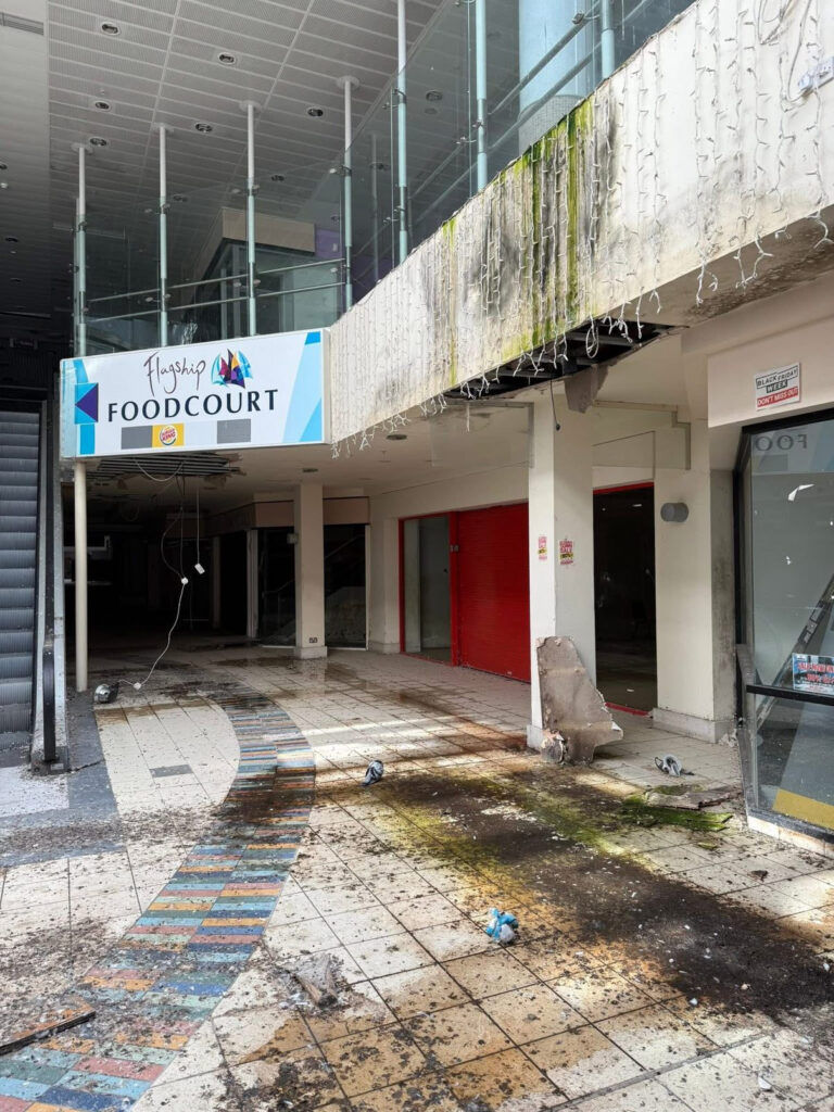 An urban explorer has revealed the eerie inside of a crumbling abandoned shopping mall in Bangor, Northern Ireland, left to rot with moss-covered floors, shattered windows and a collapsing roof.