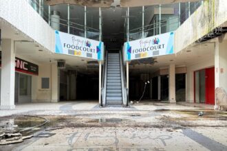 An urban explorer has revealed the eerie inside of a crumbling abandoned shopping mall in Bangor, Northern Ireland, left to rot with moss-covered floors, shattered windows and a collapsing roof.