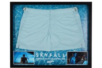 Daniel Craig’s iconic blue swimming trunks from Skyfall are up for auction, expected to fetch £3,715, with bids already coming in for the famous 007 swimwear scene.