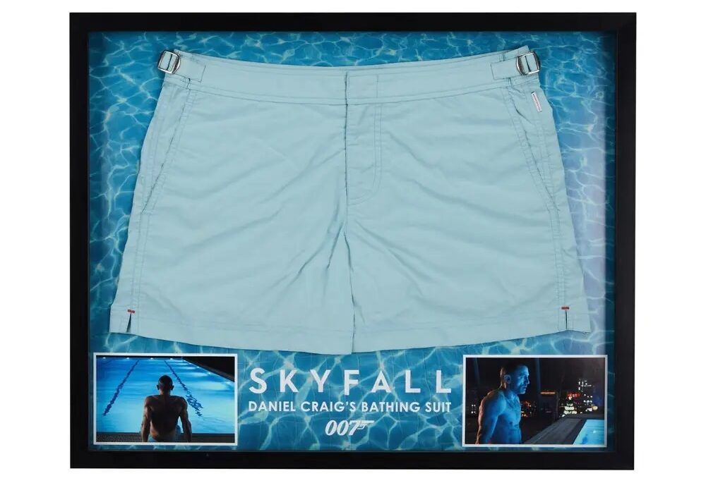 Daniel Craig’s iconic blue swimming trunks from Skyfall are up for auction, expected to fetch £3,715, with bids already coming in for the famous 007 swimwear scene.