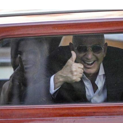 A Jeff Bezos lookalike has hired three bodyguards costing £440 a day after being mobbed by fans and paparazzi, with some Amazon staff even mistaking him for the billionaire.