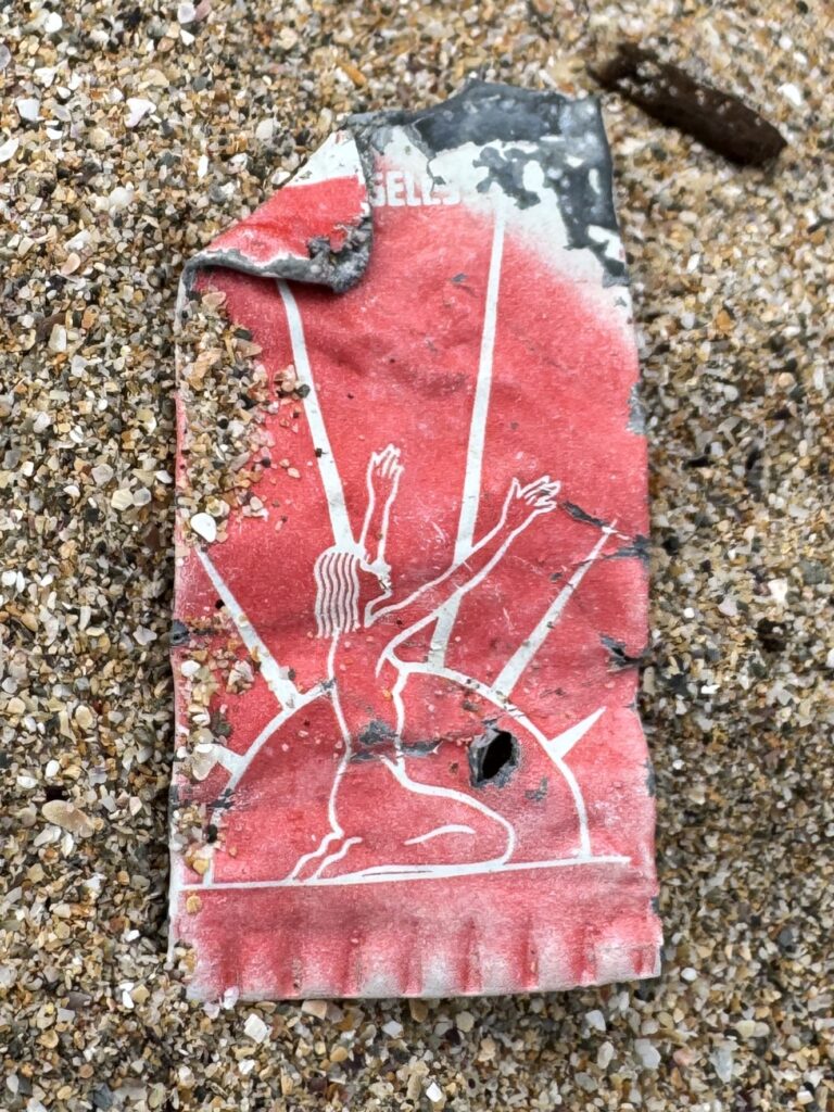 A beach cleaner found decades old litter on Fistral Beach including a 52 year old crisp packet a 1930s Cooltan tube and a lobster tag that travelled 3,000 miles highlighting ocean waste’s long life.