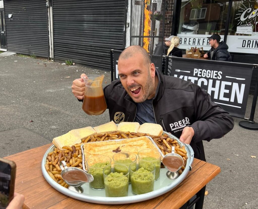 Café launches 11,000-calorie pie challenge with giant portions of pie, chips, peas, bread, and gravy. Twelve have tried and failed to finish the mammoth northern feast.