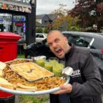 Café launches 11,000-calorie pie challenge with giant portions of pie, chips, peas, bread, and gravy. Twelve have tried and failed to finish the mammoth northern feast.