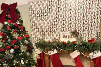Naomi’s lounge turned into a Santa’s Grotto, after putting Christmas wrapping paper on the walls.