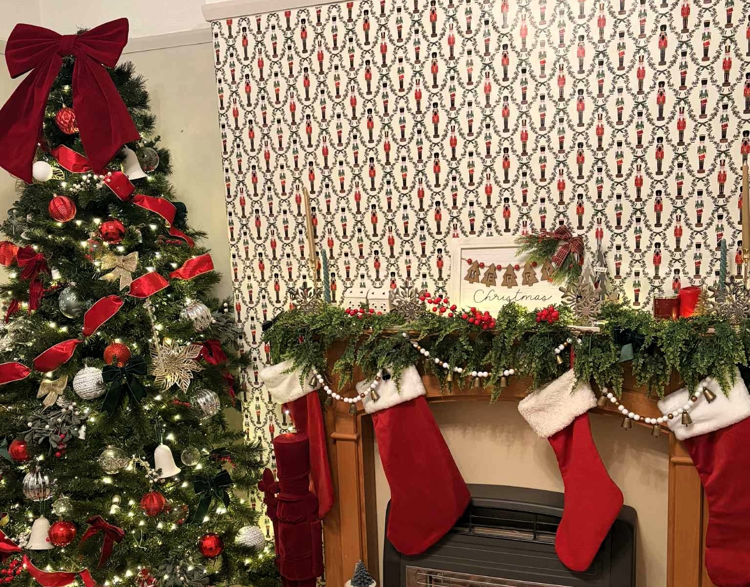 Naomi’s lounge turned into a Santa’s Grotto, after putting Christmas wrapping paper on the walls.