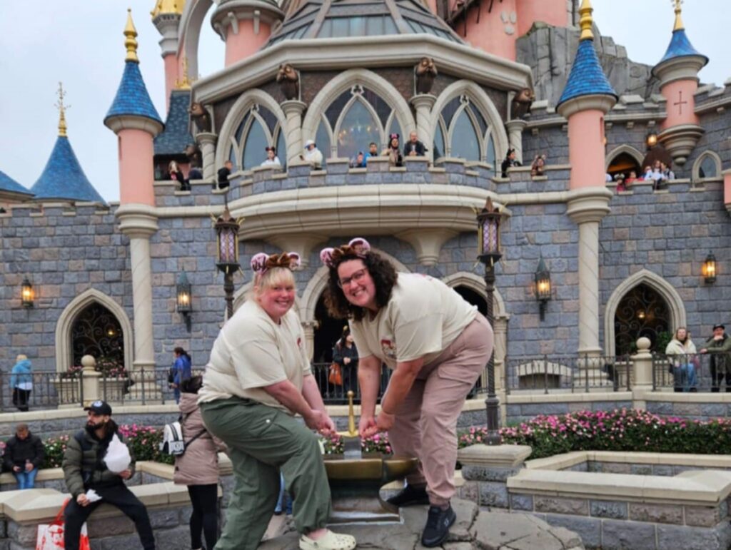 Sasha (L) with her partner, Rhian (R) at Disneyland.