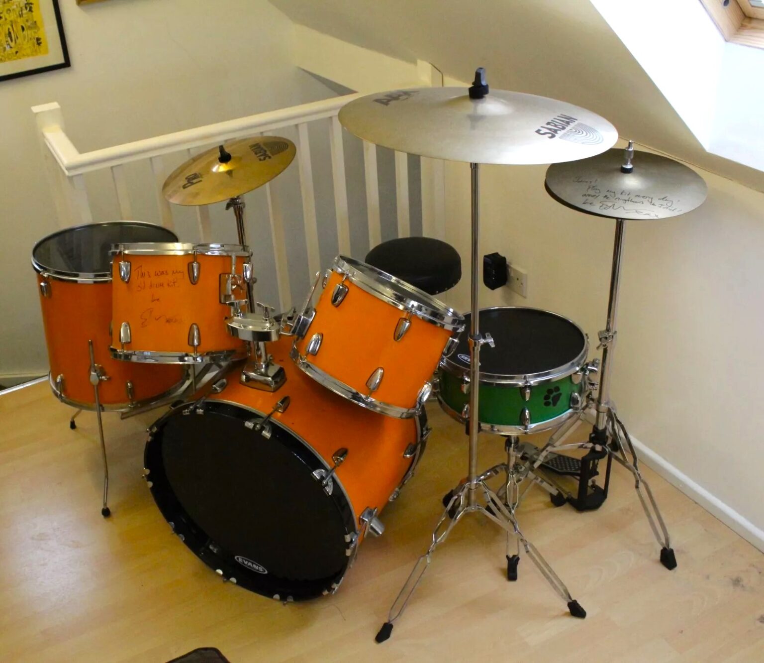 Ed Sheeran’s old orange drum kit, played and painted by him as a teen, is up for sale on eBay for £5,000 after being donated to charity and signed by the superstar.