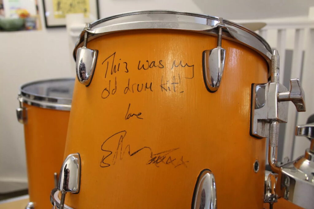 Ed Sheeran’s old orange drum kit, played and painted by him as a teen, is up for sale on eBay for £5,000 after being donated to charity and signed by the superstar.
