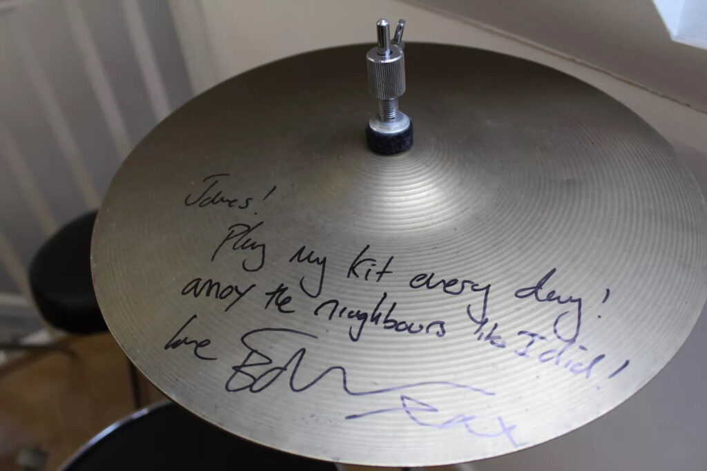 Ed Sheeran’s old orange drum kit, played and painted by him as a teen, is up for sale on eBay for £5,000 after being donated to charity and signed by the superstar.