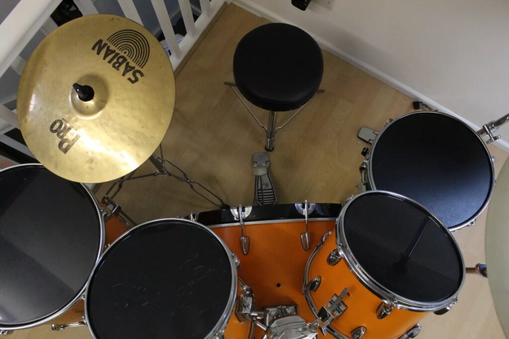 Ed Sheeran’s old orange drum kit, played and painted by him as a teen, is up for sale on eBay for £5,000 after being donated to charity and signed by the superstar.