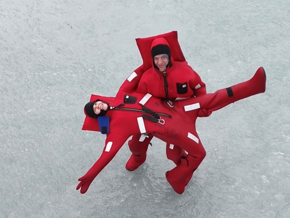 A new extreme winter trend called ice floating is going viral - thrill-seekers in red suits dive into freezing Arctic waters in Russia for the ultimate icy adventure.