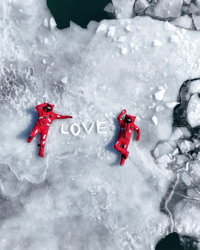 A new extreme winter trend called ice floating is going viral - thrill-seekers in red suits dive into freezing Arctic waters in Russia for the ultimate icy adventure.