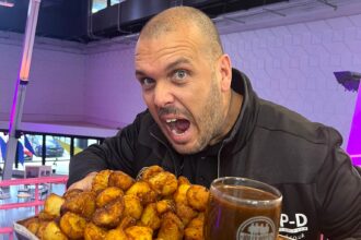 Foodie Jonny Adams tackled a 10,000 calorie roast potato challenge but quit after six minutes when the 4.5kg mountain of roasties left him bloated and sick for hours.