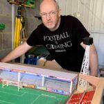 A football fan built a 6,000-seater Subbuteo replica of Cheltenham Town’s stadium in his garage, even selling his classic car to make space for the incredible lockdown project.