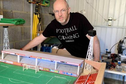A football fan built a 6,000-seater Subbuteo replica of Cheltenham Town’s stadium in his garage, even selling his classic car to make space for the incredible lockdown project.