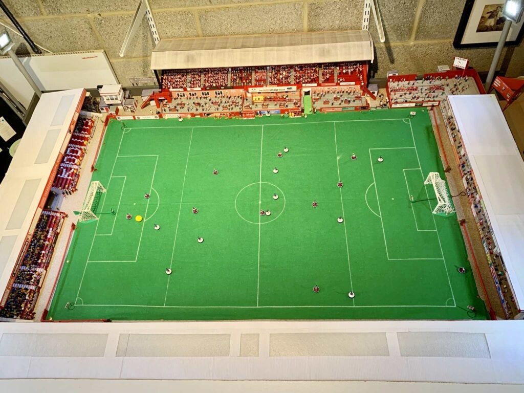 A football fan built a 6,000-seater Subbuteo replica of Cheltenham Town’s stadium in his garage, even selling his classic car to make space for the incredible lockdown project.