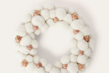 Luxury brand Loro Piana releases 2070 pound cashmere and silk Christmas wreath featuring Cashfur fabric and wooden details sparking buzz as one of the priciest festive decorations ever.