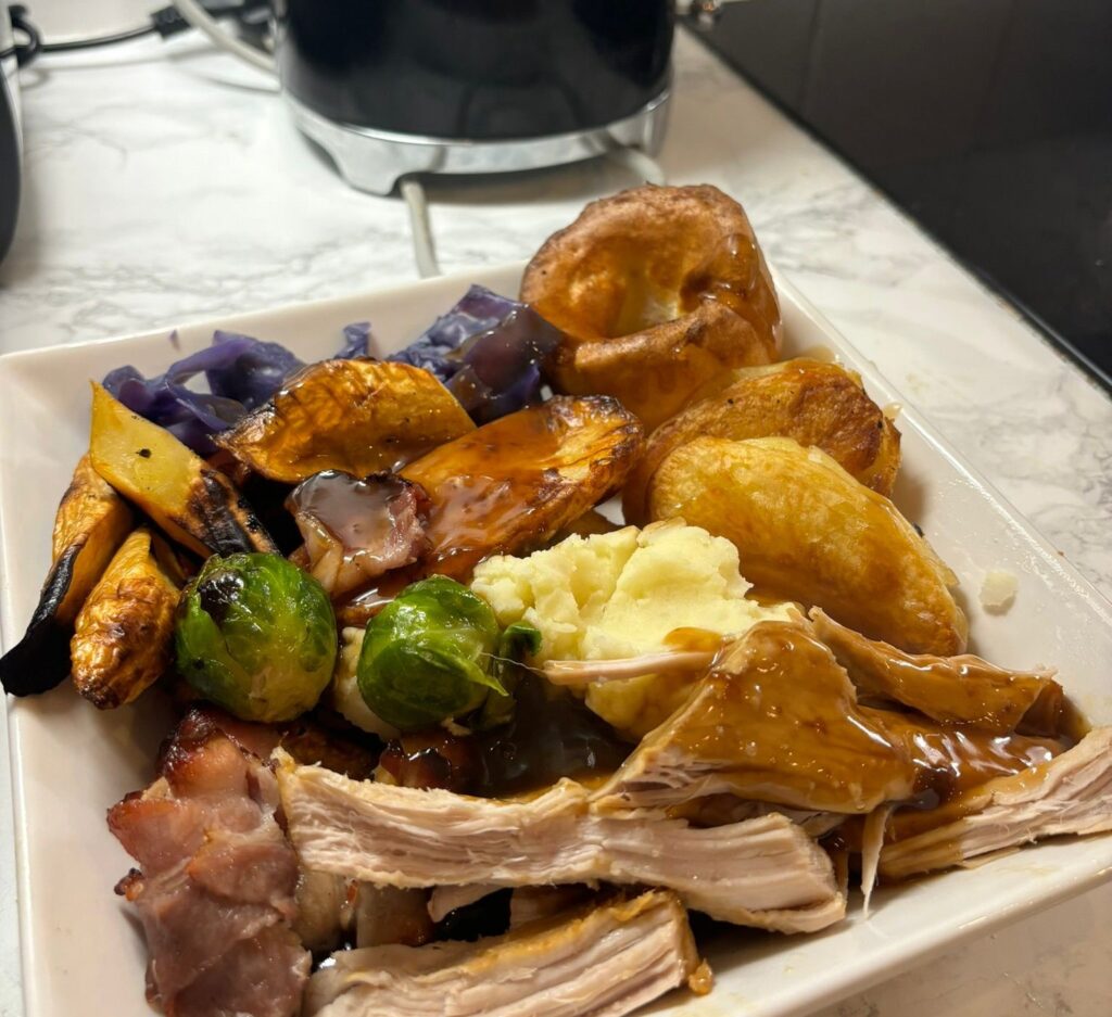 Frugal mum Charlene Woracker shows how to cook a full Christmas dinner for a family of four for just 10 pounds proving budget friendly festive meals can still be delicious and joyful.