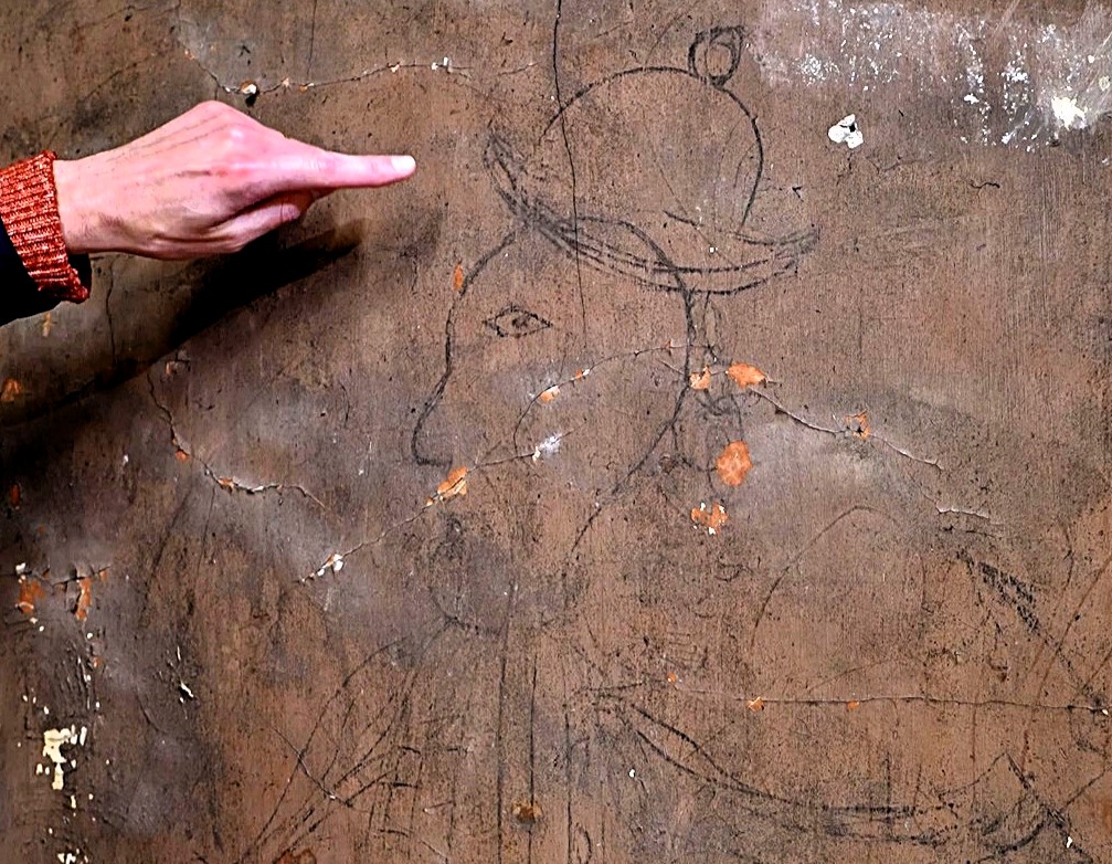 Graffiti discovered at Hampton Court Palace depicts the man in period dress, wearing a coat and headwear and holding an arrow, with 1626 carved beneath it.