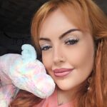 Hannah with a Jellycat cuddly toy.