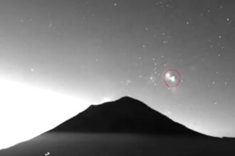 Two triangle shaped UFOs filmed rising from Mexicos Popocatepetl volcano spark wild theories as mysterious glowing objects appear minutes apart above one of the nations most active peaks.