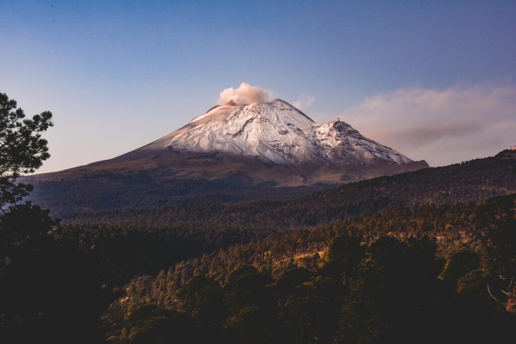 Two triangle shaped UFOs filmed rising from Mexicos Popocatepetl volcano spark wild theories as mysterious glowing objects appear minutes apart above one of the nations most active peaks.
