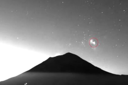 Two triangle shaped UFOs filmed rising from Mexicos Popocatepetl volcano spark wild theories as mysterious glowing objects appear minutes apart above one of the nations most active peaks.