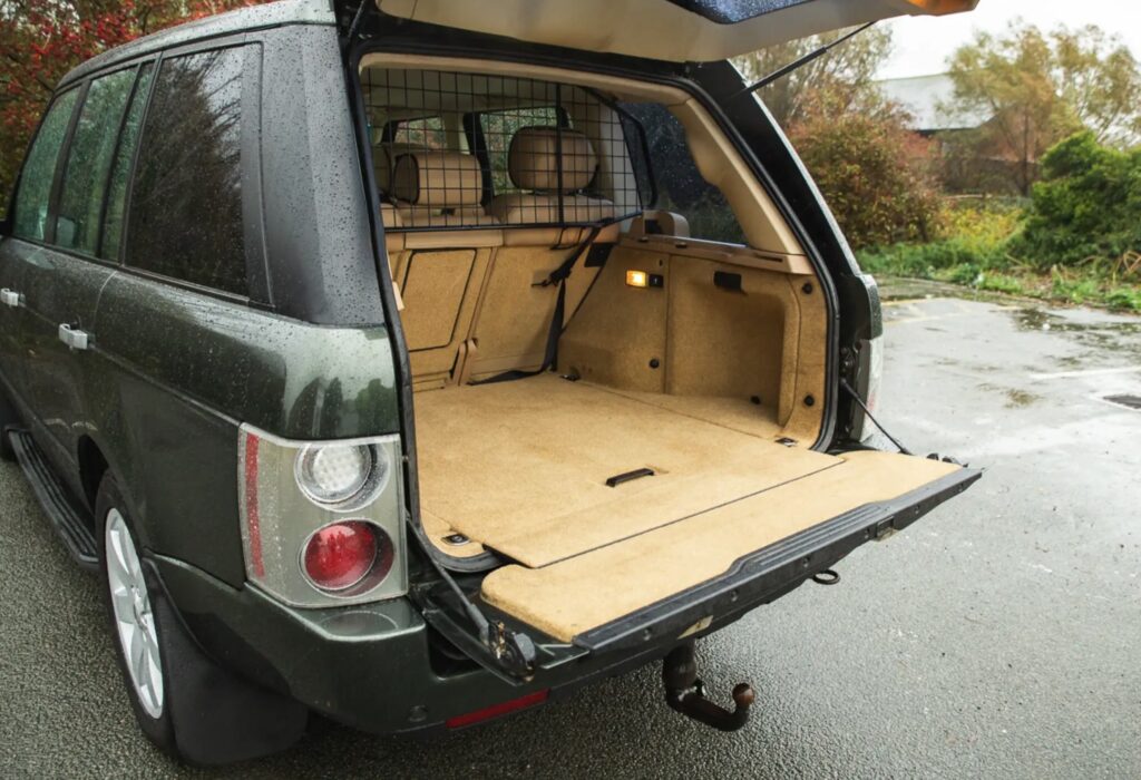 A 2007 Range Rover once owned by Queen Elizabeth II sold for £66,375 after restoration, featuring royal touches like corgi dog guards and links to Prince Philip and Sandringham.