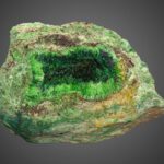 A rare green cuprosklodowskite mineral sample from the Congo is up for auction in Dallas with bids starting at $500 prized for its radioactive beauty and unique uranium rich crystal structure.