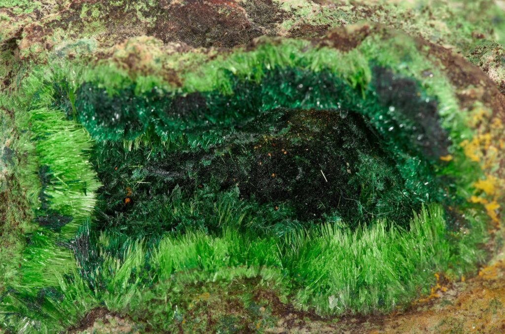 A rare green cuprosklodowskite mineral sample from the Congo is up for auction in Dallas with bids starting at $500 prized for its radioactive beauty and unique uranium rich crystal structure.